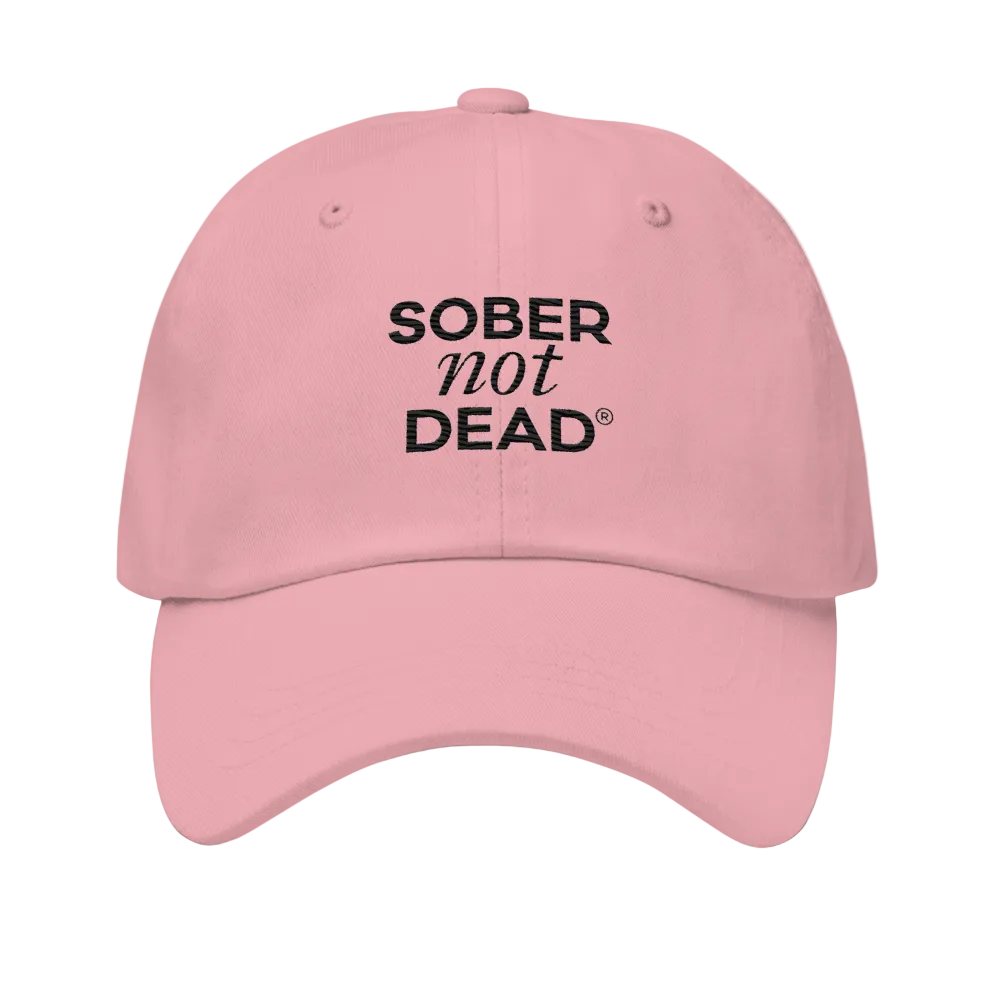 Pink cap with 'SOBER not DEAD' text on a white background
